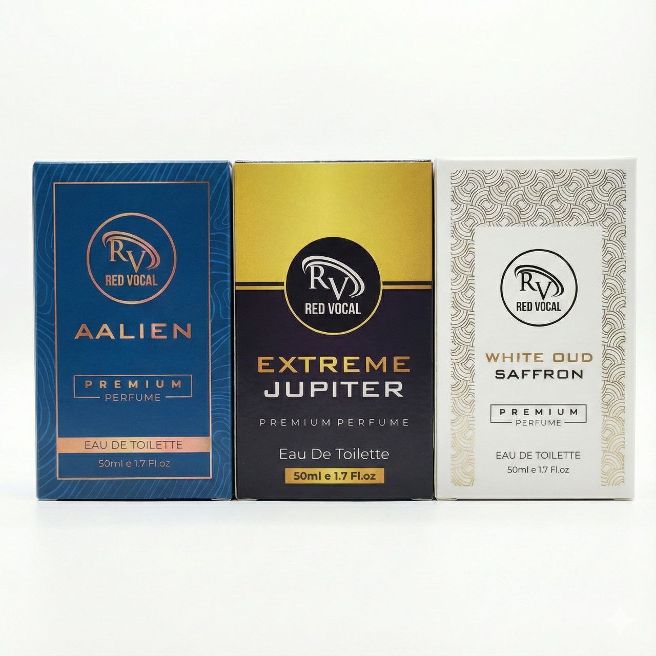 Three perfume boxes from Red Vocal on a white background Three boxes of Red Vocal fragrances on a marble surface with decorative elements.