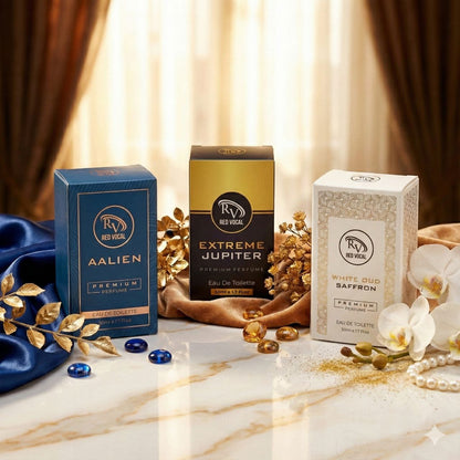 Three boxes of Red Vocal fragrances on a marble surface with decorative elements.