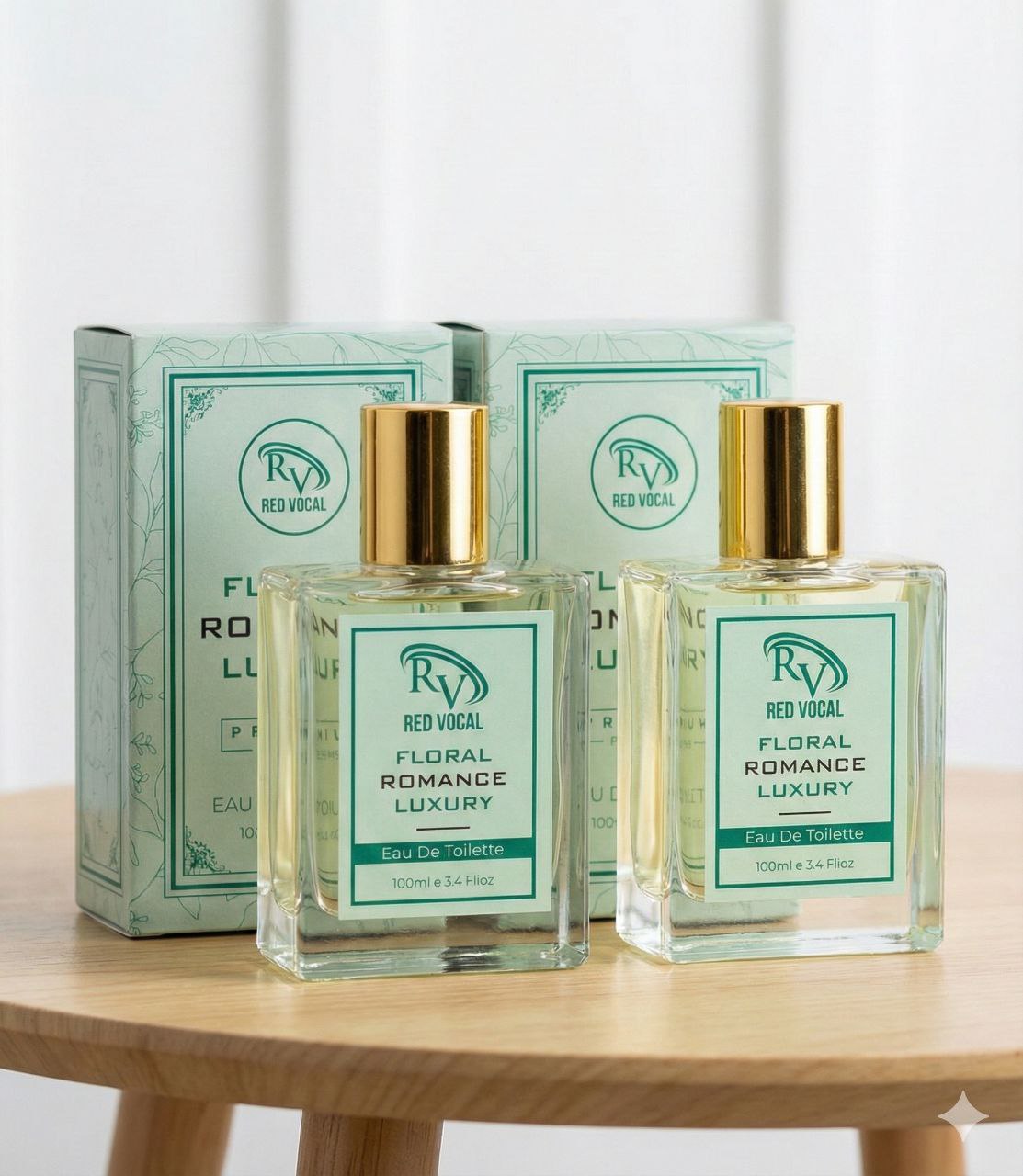 Two bottles of 'Floral Romance Luxury' perfume by Red Vocal on a wooden table with their packaging. Red Vocal Floral Romance Luxury Premium Perfume Eau De Toilette – Women’s 100ml Elegant & Long-Lasting Set of 2 Fragrance