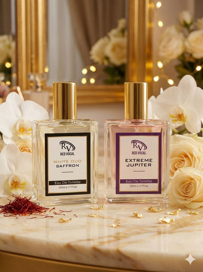 Two perfume bottles on a marble surface with flowers and saffron strands. Red Vocal White Oud Saffron For Unisex & Extreme Jupiter Premium Perfume Set For Women | Long-Lasting Eau De Toilette | 2 x 50ml