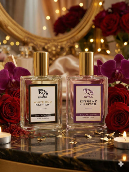 Two perfume bottles on a decorative table with flowers and candles in the background Red Vocal White Oud Saffron For Unisex & Extreme Jupiter Premium Perfume Set For Women | Long-Lasting Eau De Toilette | 2 x 50ml