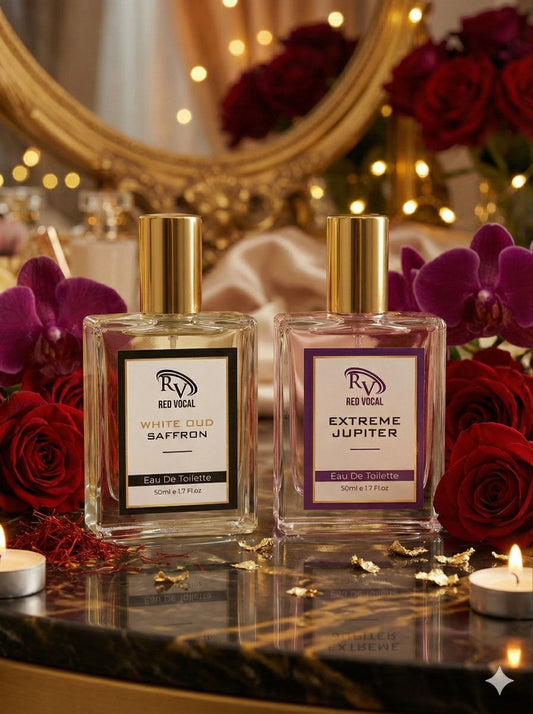 Two perfume bottles on a decorative table with flowers and candles in the background Red Vocal White Oud Saffron For Unisex & Extreme Jupiter Premium Perfume Set For Women | Long-Lasting Eau De Toilette | 2 x 50ml