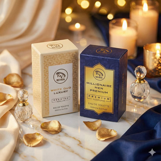 Two perfume boxes, one gold and one blue, on a marble surface with decorative elements. WhiteOudandMillionaireMenPremium_1