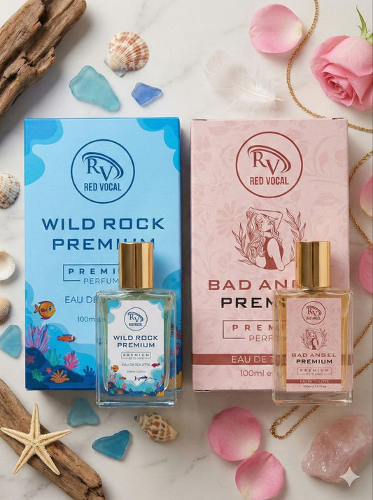 Two perfume bottles with their packaging on a decorative background with flowers and seashells. Red Vocal Wild Rock Premium For Men & Bad Angel Premium Perfume Set For Women | Long-Lasting Eau De Toilette | 2 x 100ml